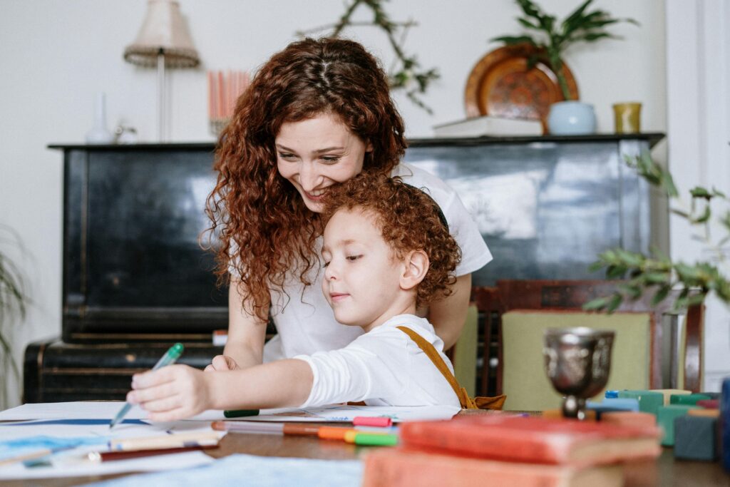 pexels-photo-4039177-4039177 A loving mother and her child enjoy drawing together at home, fostering creativity and family bonding.